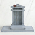 Grey wooden barn figurine open - brown star standing on it