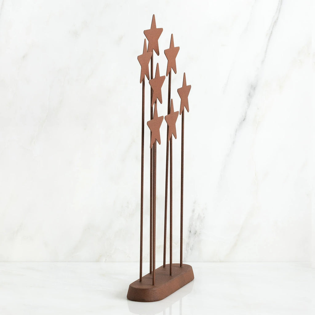 Bronze plaque with star stands on top of it