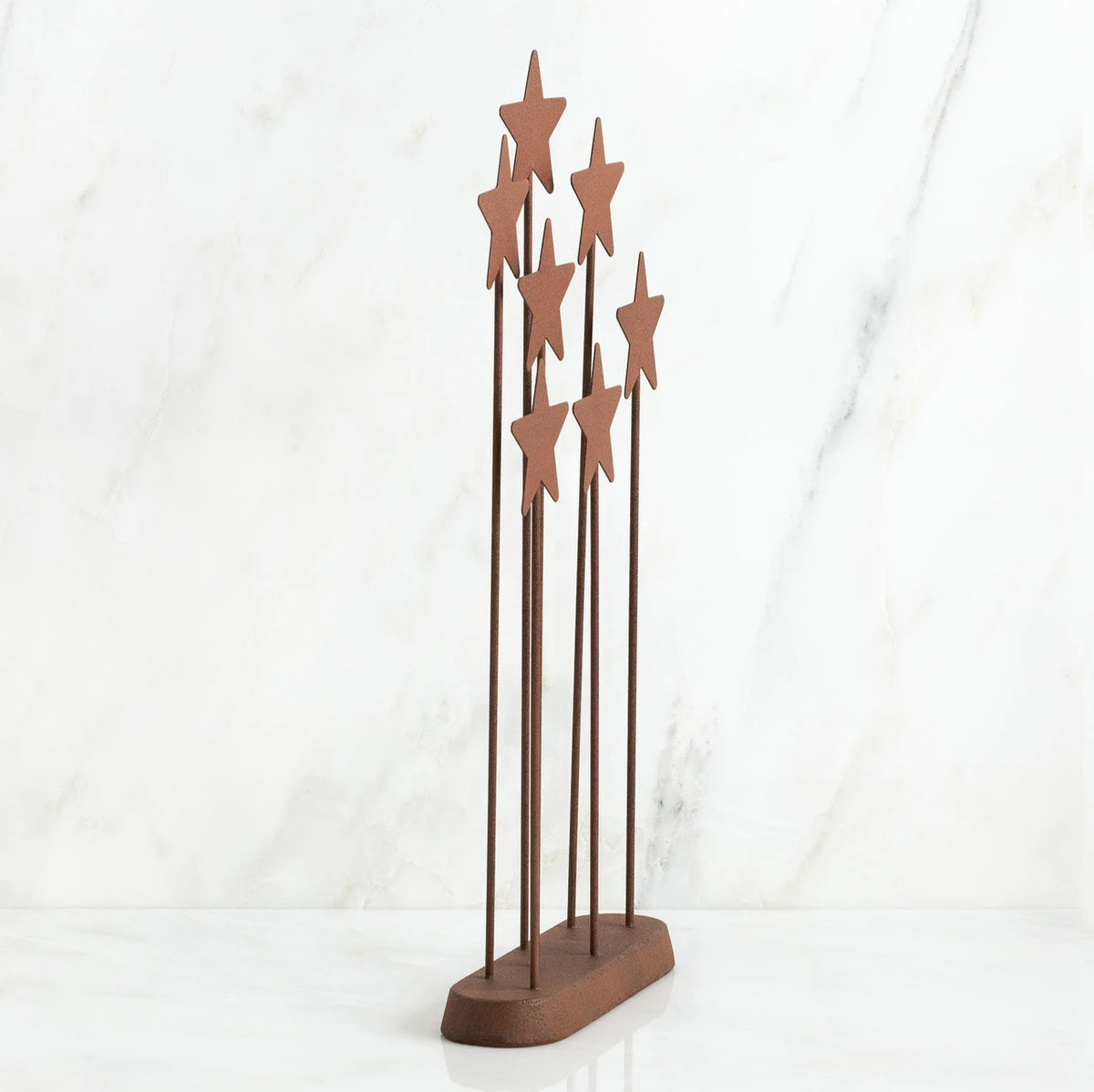 Bronze plaque with star stands on top of it