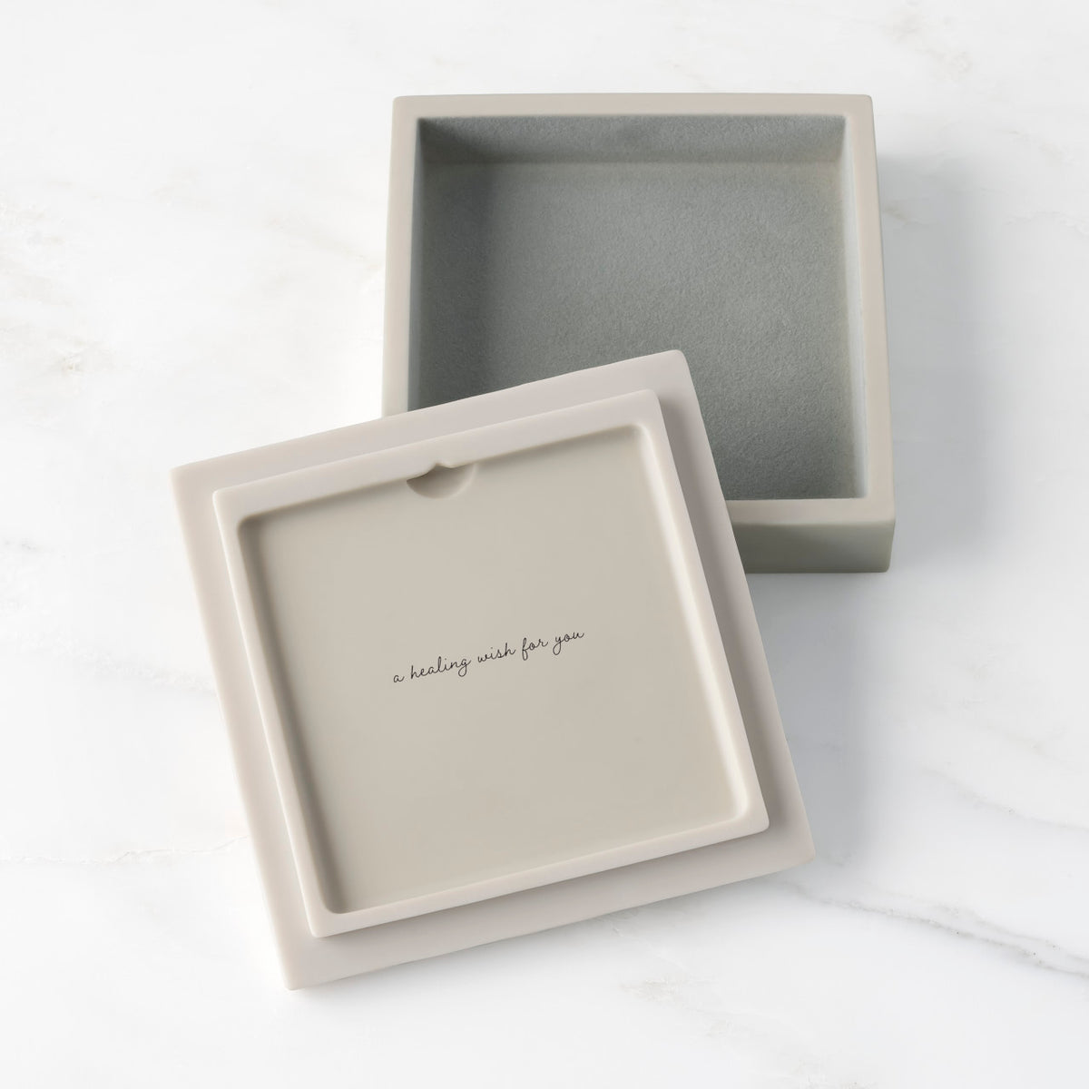 White resin box with detached lid showing sentiment on lid back; velvety gray-green finish in box base