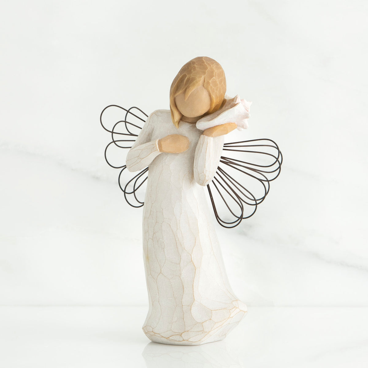 Blonde faceless girl holding white shell to her ear wearing white dress and black wire angel wings