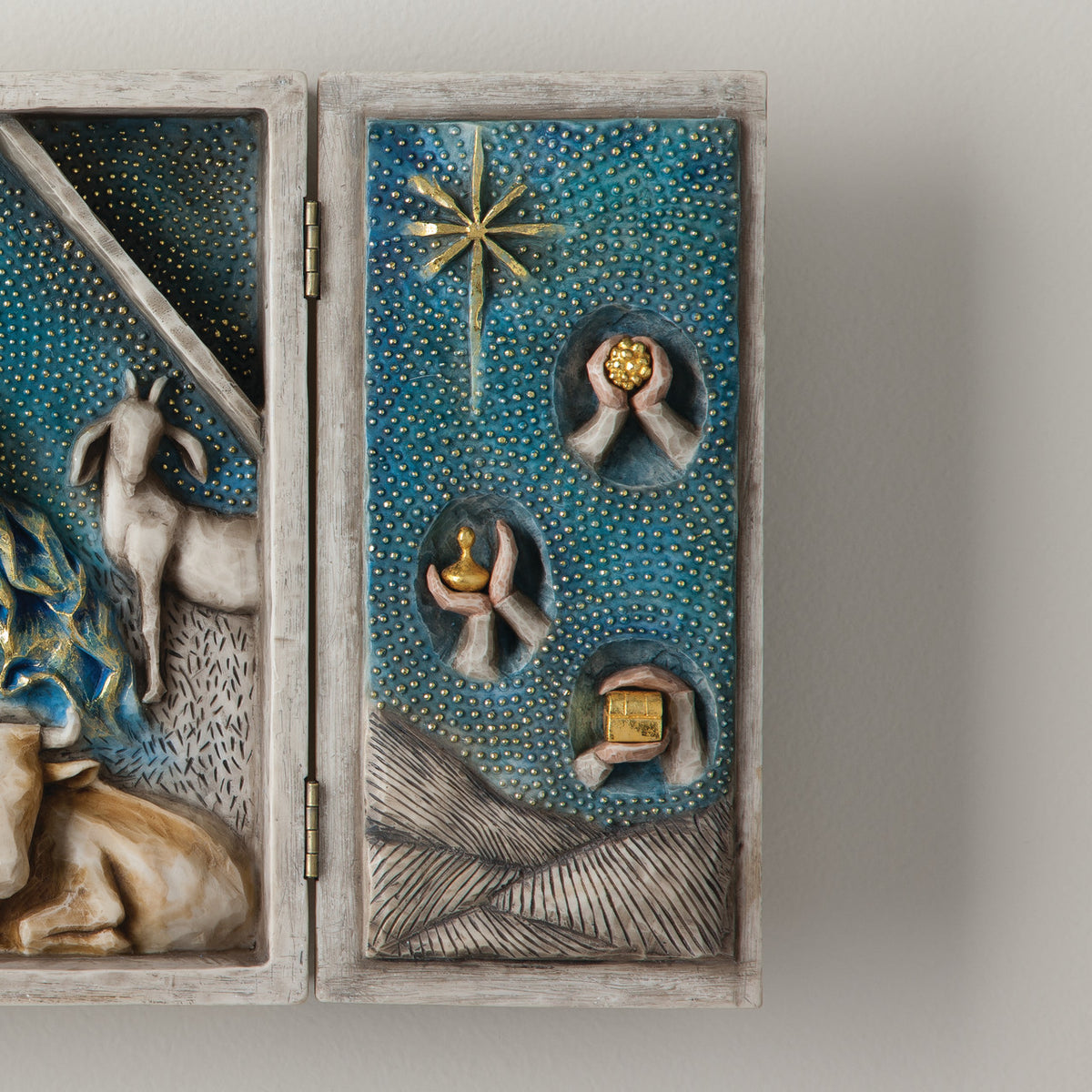 A hinged resin box, done in a Willow Tree format that tells the story of the Nativity