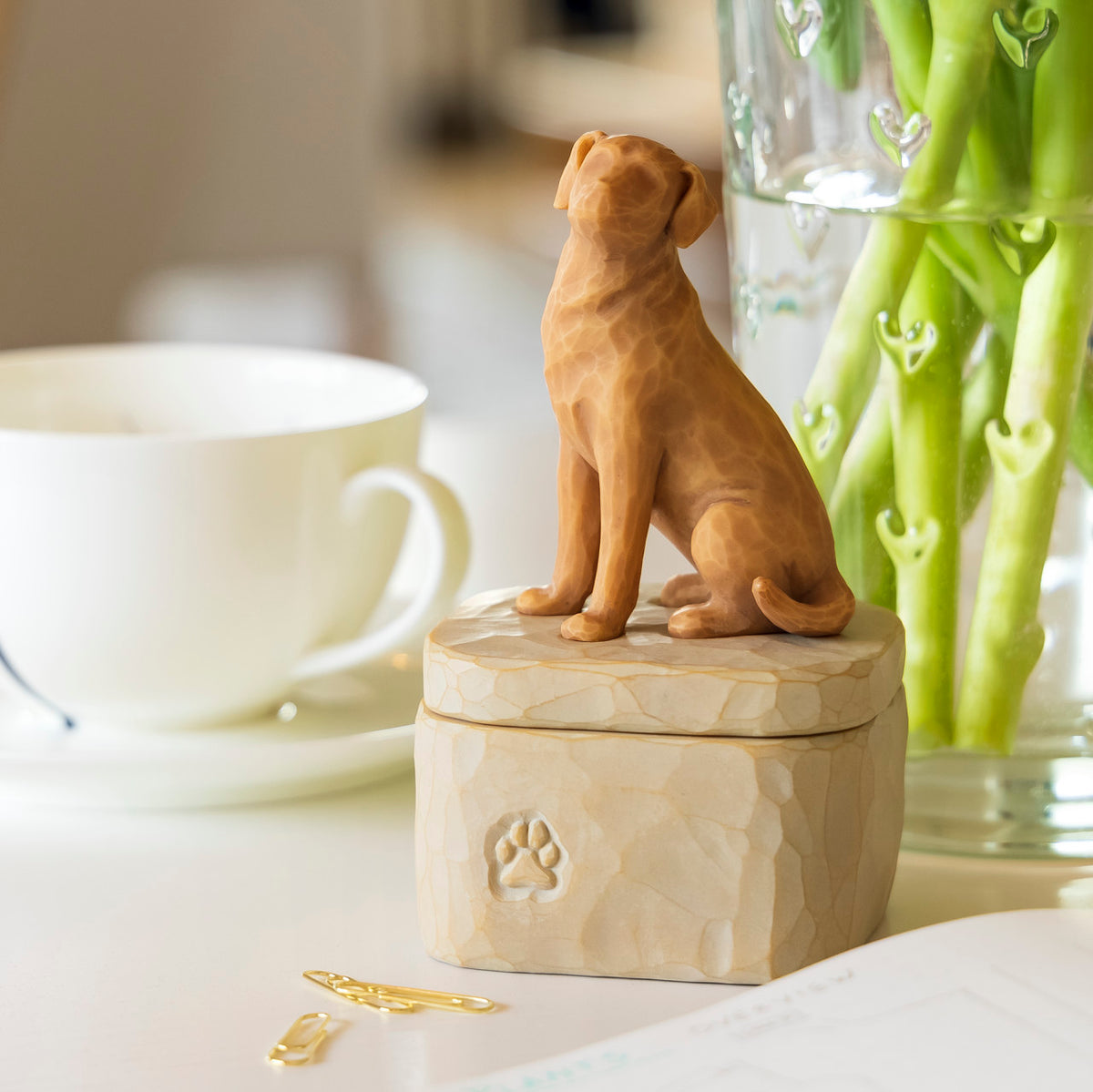 Willow Tree Love my Dog (golden) Keepsake Box, 3"w x 3.25”d hand-painted resin box with 3.4”H carved figure of golden dog affixed to lid, on kitchen table